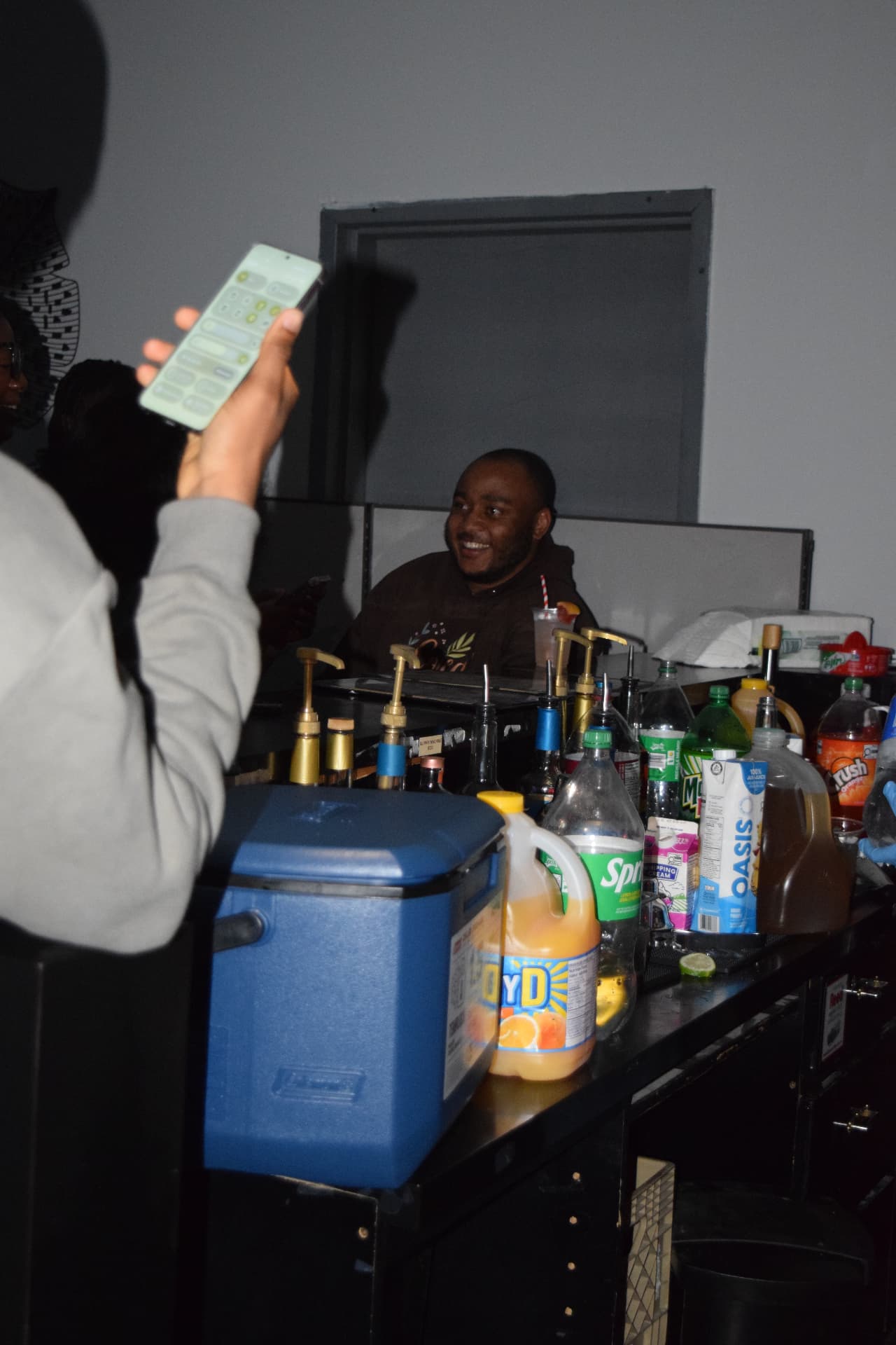 Nektar bartender serving guests at an evening event